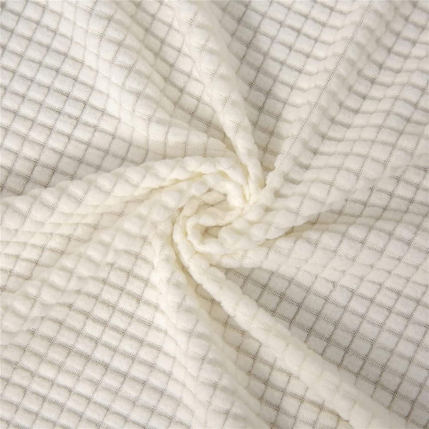 Matière de la housse de canapé Cléa en coton extensible, moderne et durable.