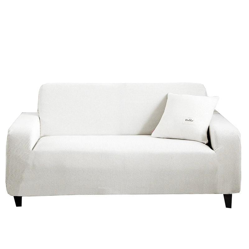 Housse de canapé Cléa en coton extensible, moderne et durable blanche.