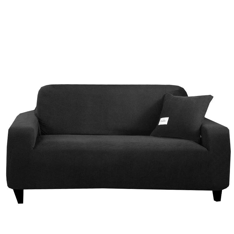 Housse de canapé Cléa en coton extensible, moderne et durable noir.