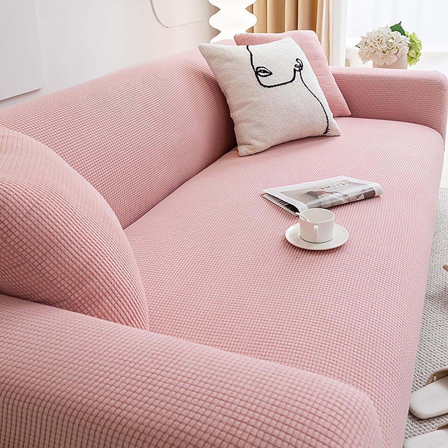 Housse de canapé Cléa en coton extensible, moderne et durable rose.